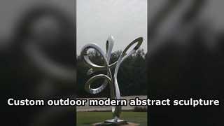 এই বিমূর্ত রৈখিক স্টেইনলেস স্টিলের আয়না ভাস্কর্যে তরল, আন্তঃ বোনা বক্ররেখা রয়েছে